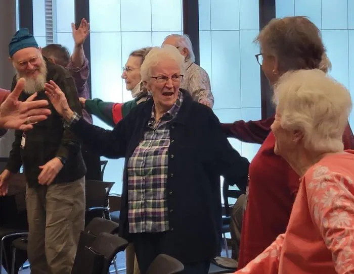 Warm-up stretches during Good Memories Choir rehearsal