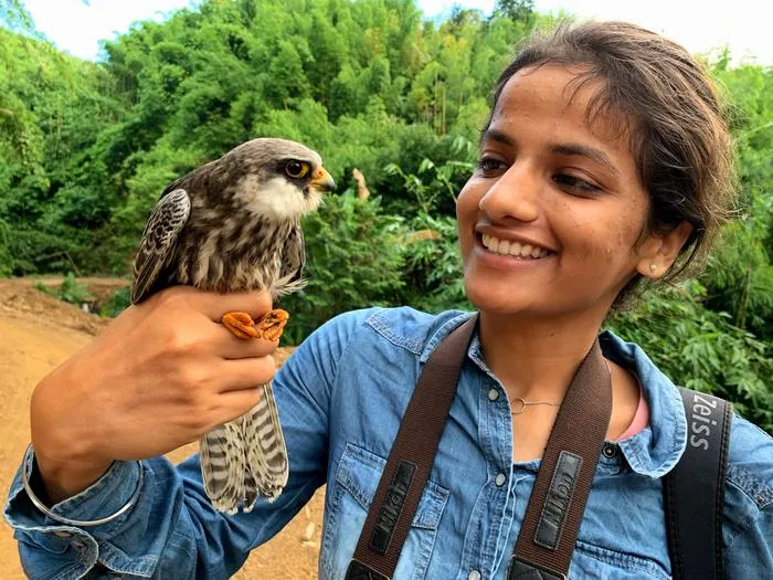 2025 BioOne Ambassador Amarjeet Kaur with an Amur Falcon