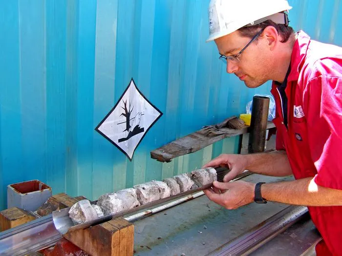 Professor Jody Webster with a core extracted from beneath the Great Barrier Reef's shelf edge
