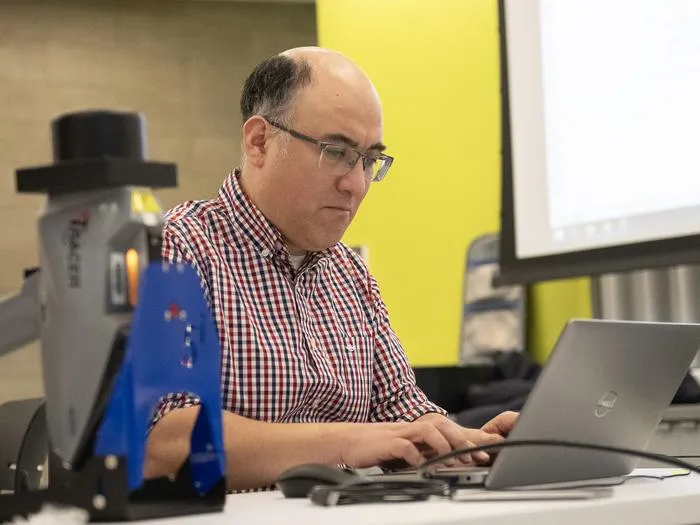 An archaeologist at his computer