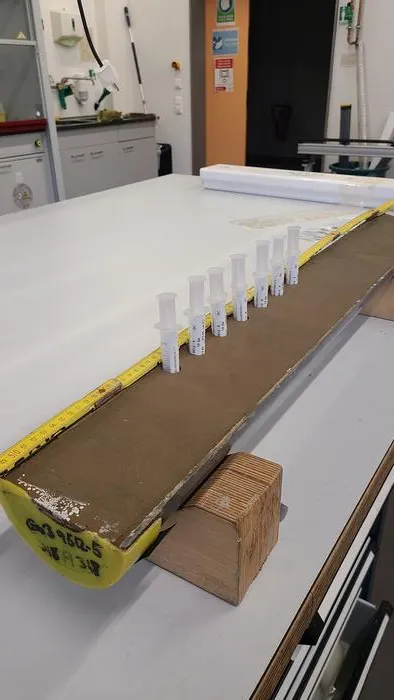 Sampling a section of the studied core in the laboratory of the GeoB Core Repository at the University of Bremen. Photo: MARUM – Center for Marine Environmental Sciences, University of Bremen; S. Barragán-Montilla