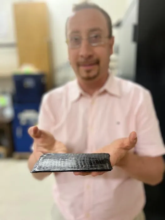 Dr. Mohammad Naraghi showcasing ATSP, the carbon-fiber smart plastic.