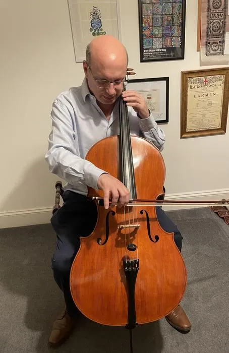 David Rubinsztein playing his cello, which he describes as his “most treasured possession.”