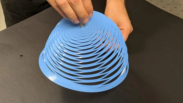 A closed-loop kirigami pattern allows a plastic sheet to adopt the shape of an inverted bell