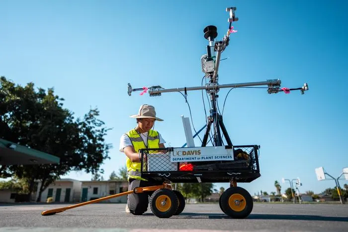 Researchers with temperature measuring cart
