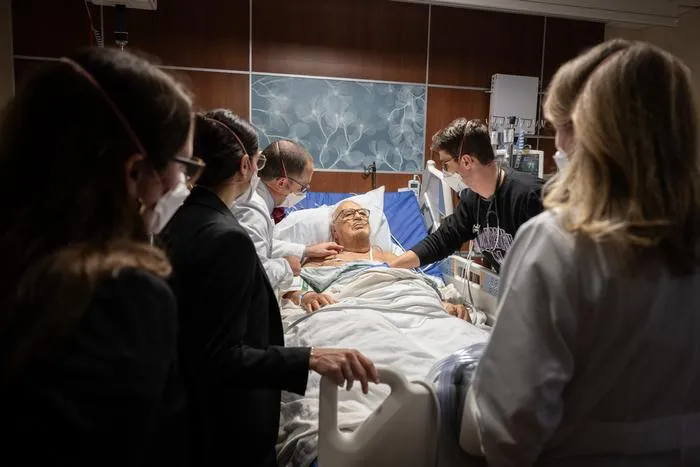 Dr. Garibaldi leads a patient exam