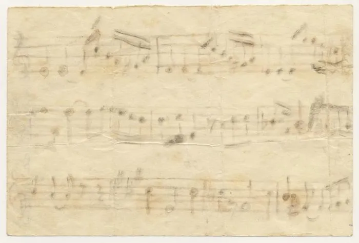 Unfinished melody written by Jorge Peña Hen with burned matchsticks