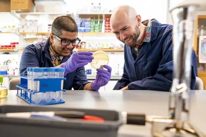 Lawrence Uricchio and Kasturi Lele in the lab