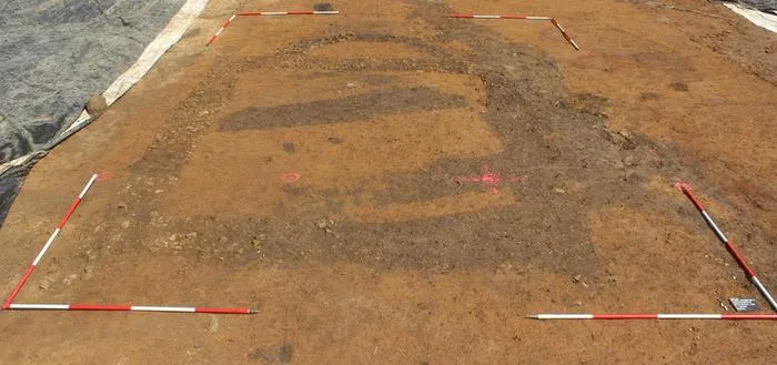 Excavated remains of a stone building with an apse