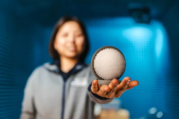 researcher holding prototype