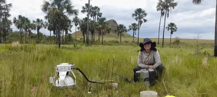 Larissa Verona measures greenhouse gas emissions from the soil using the LI-COR instrument.