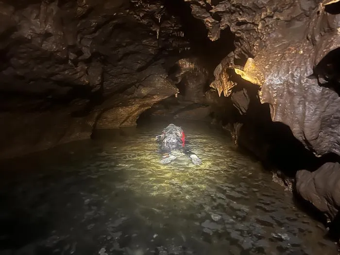 John Moretti snorkeling in water cave