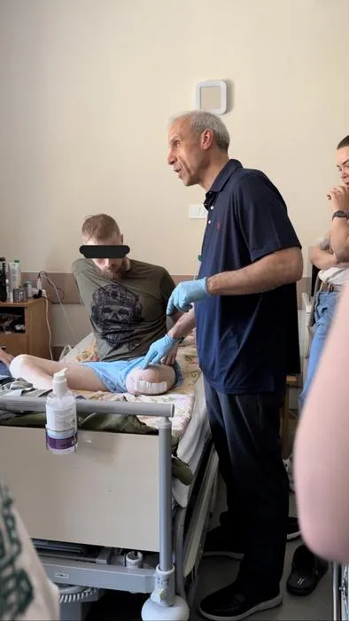Dr. Cohen evaluating a Ukrainian Service Member with a left lower extremity amputation for consideration of medications and possible nerve blocks
