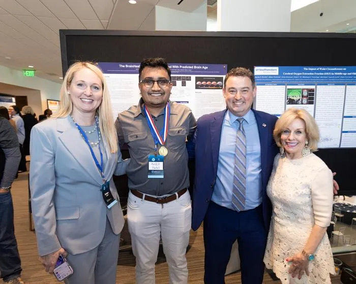 Authors Honea, Patel and Chapman with UTD's Dean Woods
