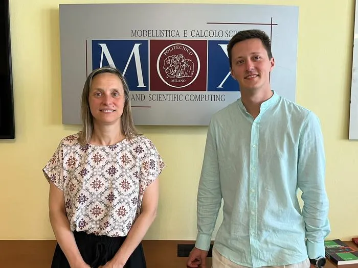 Mattia Corti and Paola Antonietti with the MOX Laboratory logo