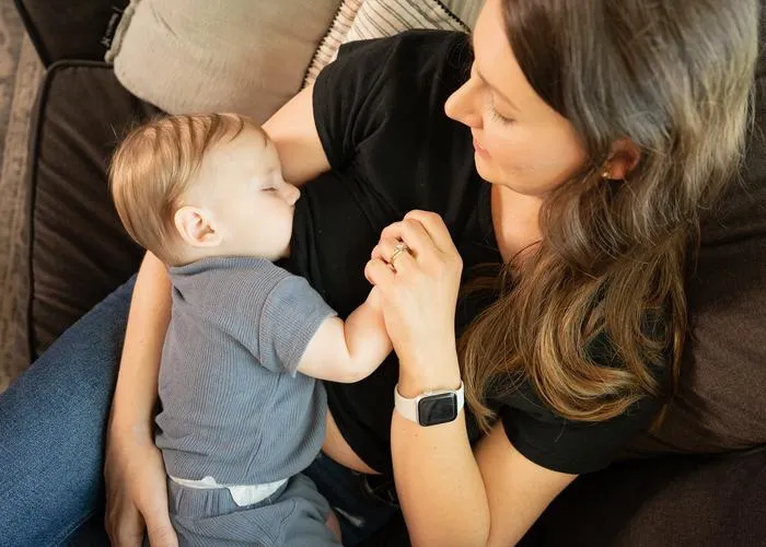 Emily breastfeeds her son, Luca