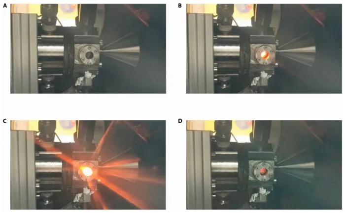 Fig. 4. The images of the (A) preignition state, (B) arc loading, (C) ignition running, and (D) hot-fire ending of the thruster.