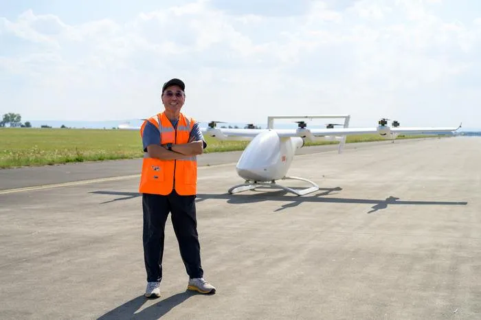 NTU Prof James Wang, Director, eVTOL Research and Innovation Centre, with the 8-metre prototype at DLR.