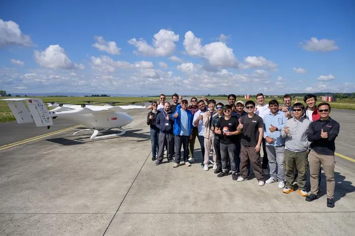 The NTU team and their collaborators with the 8-metre wingspan eVTOL prototype