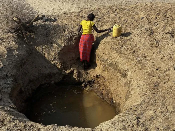 Woman at deep well