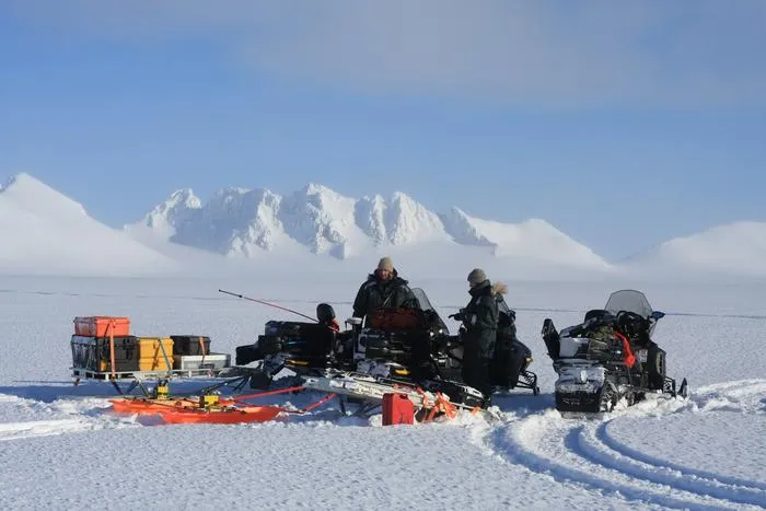 Conducting a radar survey on a Svalbard glacier during winter