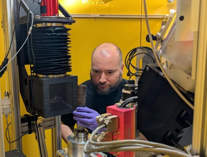Jacob LaManna scanning burned scroll at NIST