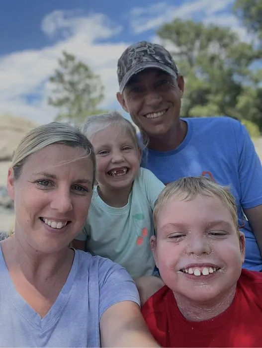 Mason Roach with his parents and sister