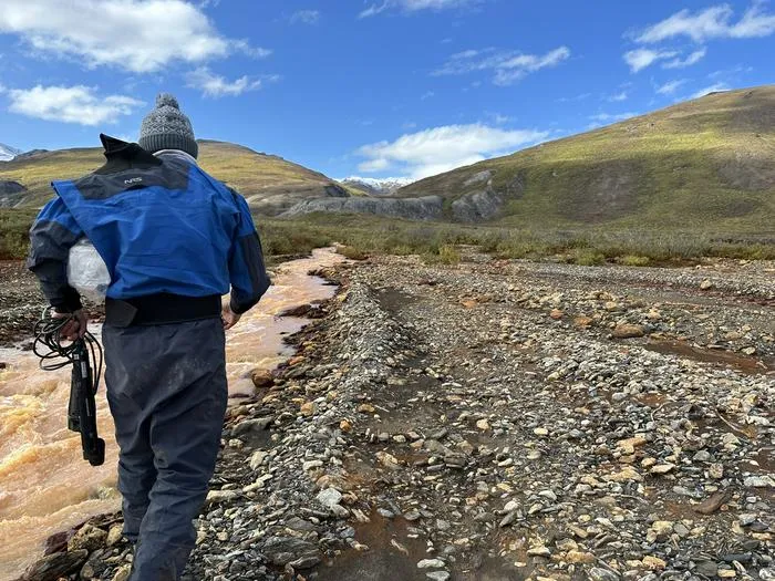 Brett Poulin sampling on Igning River AK