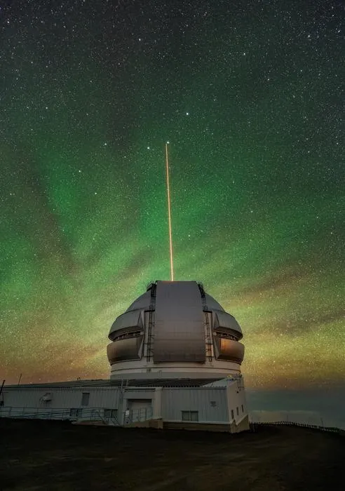 The Gemini North telescope’s laser guide star beams up into the atmosphere