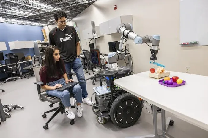 PhD students and robot
