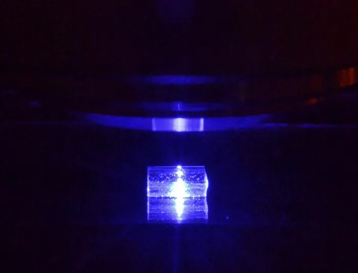 A lithium fluoride crystal under a fluorescence microscope.