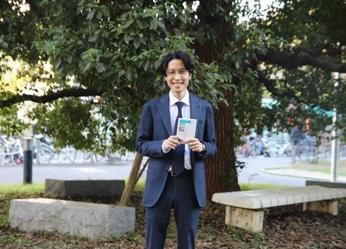 Nagoya University researcher Ryota Takano with the samurai classic Bushido